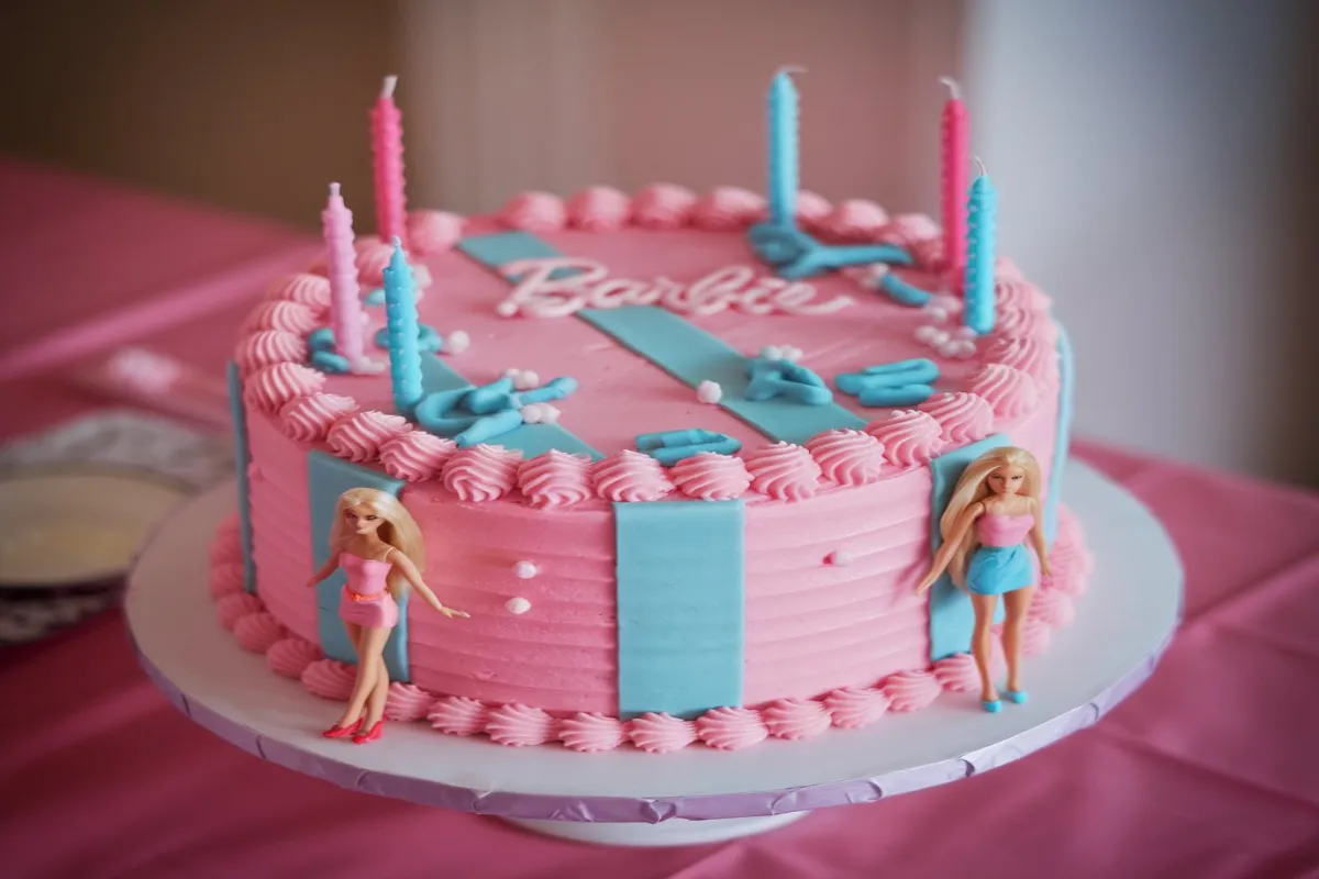 Stunning Barbie cake with intricate fondant details and colorful decorations