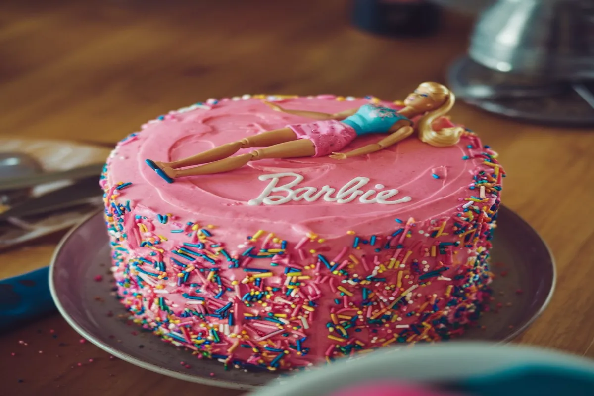 Stunning Barbie cake with intricate fondant details and colorful decorations
